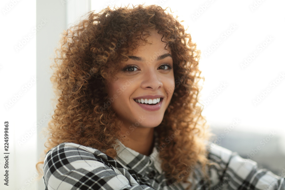 cute young woman in a plaid shirt and jeans. cute young woman in a plaid shirt and jeans.