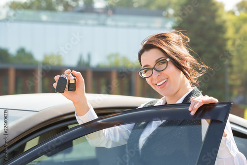 Wallpaper Mural Young business woman portrait in her car Torontodigital.ca