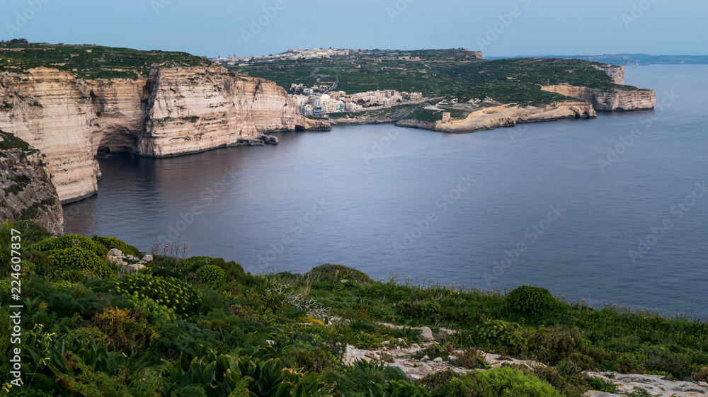 Xlendi Gozo Malta View from Clifs above. calm sea and cave visible. Horizontal. Above view.