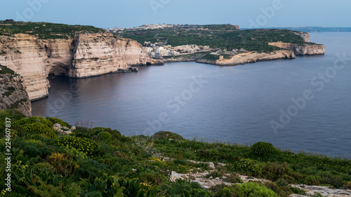Xlendi Gozo Malta View from Clifs above. calm sea and cave visible. Horizontal. Above view.