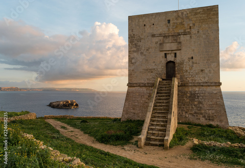 Mgarr Ix-Xini Bay Tower Gozo. Malta. Horizontal at sunset photo