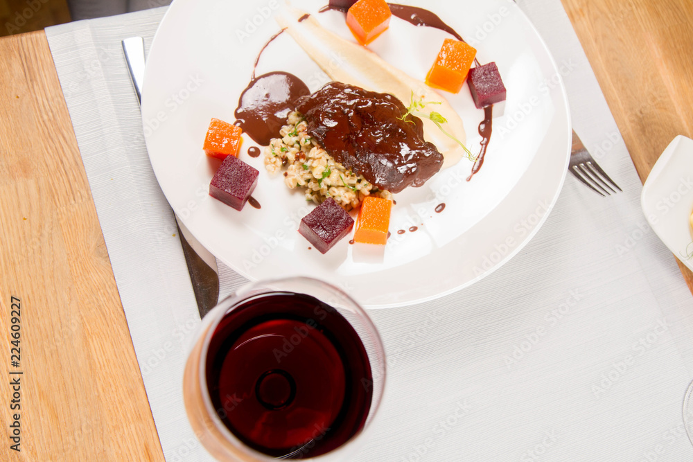 Beef cheeks with vegetables, roasted parsley root mousse , pearl barley, dark chocolate and demi glace sauce