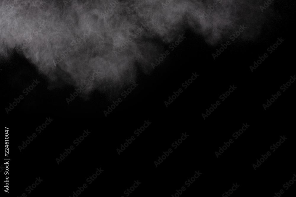 Freeze motion of white dust explosion on black background. Stopping the movement of white powder on dark background. Explosive powder white on black background. Freeze motion of white dust explosion on black background. Stopping the movement of white powder on dark background. Explosive powder white on black background.