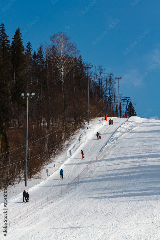 Lift for skiers and snowboarders in the winter day. Slope for skiing Lift for skiers and snowboarders in the winter day. Slope for skiing