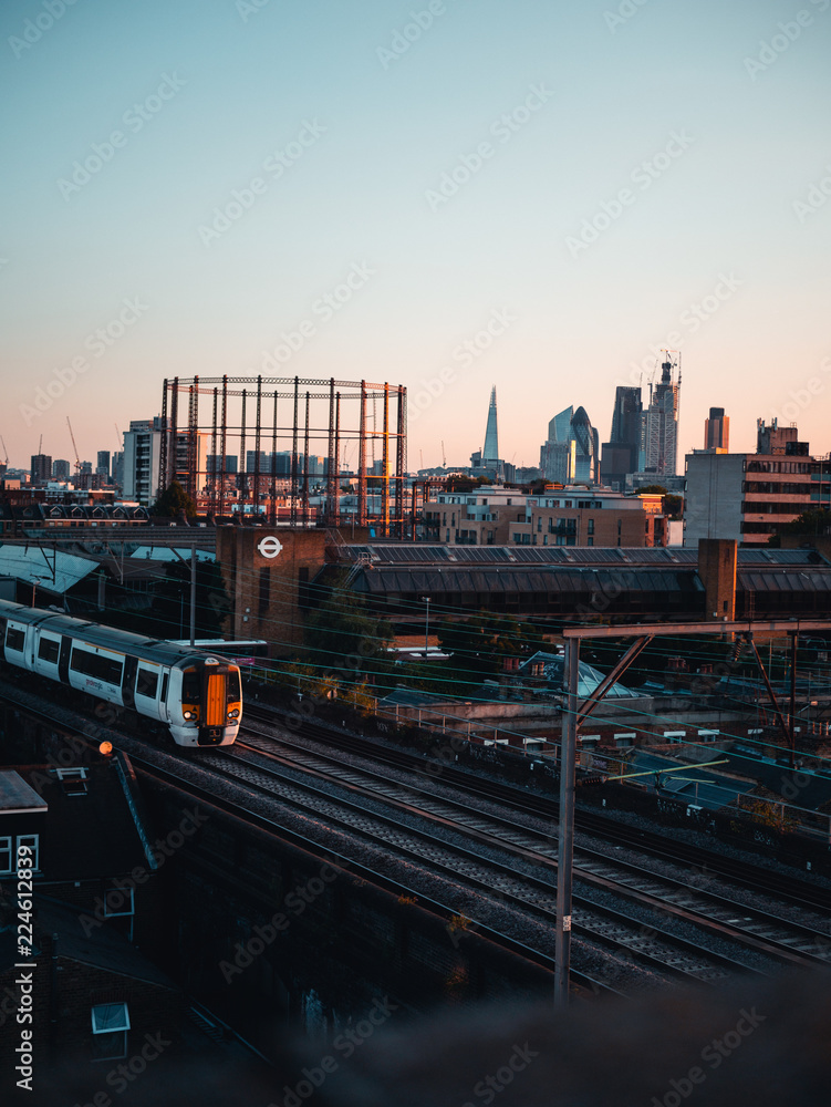 London skyline with tube and sunset