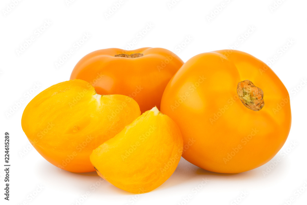 Yellow tomatoes half and slice on a white, isolated. Yellow tomatoes half and slice on a white, isolated.