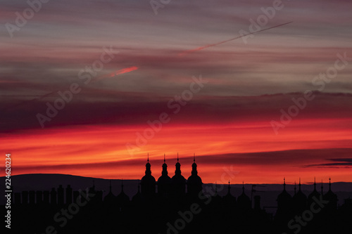 Sunset over Edinburgh with silhouettes of chimneys