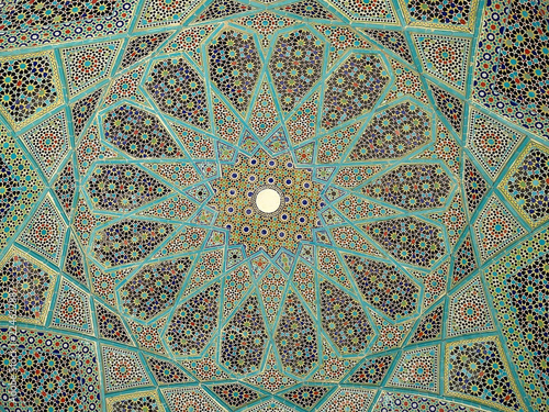 Detail of blue geometric patterns on the ceiling of a pavilion at the Tomb of Hafez, a memorial to a famous Iranian poet, in the city of Shiraz in southern Iran