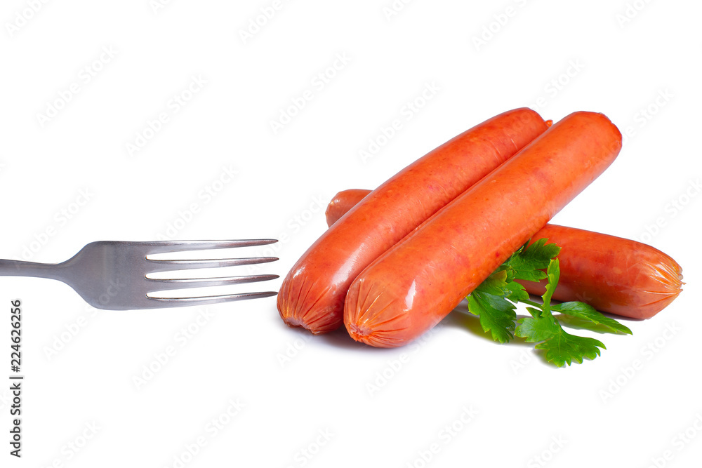 Fork with sausages and parsley on a white isolated background Fork with sausages and parsley on a white isolated background