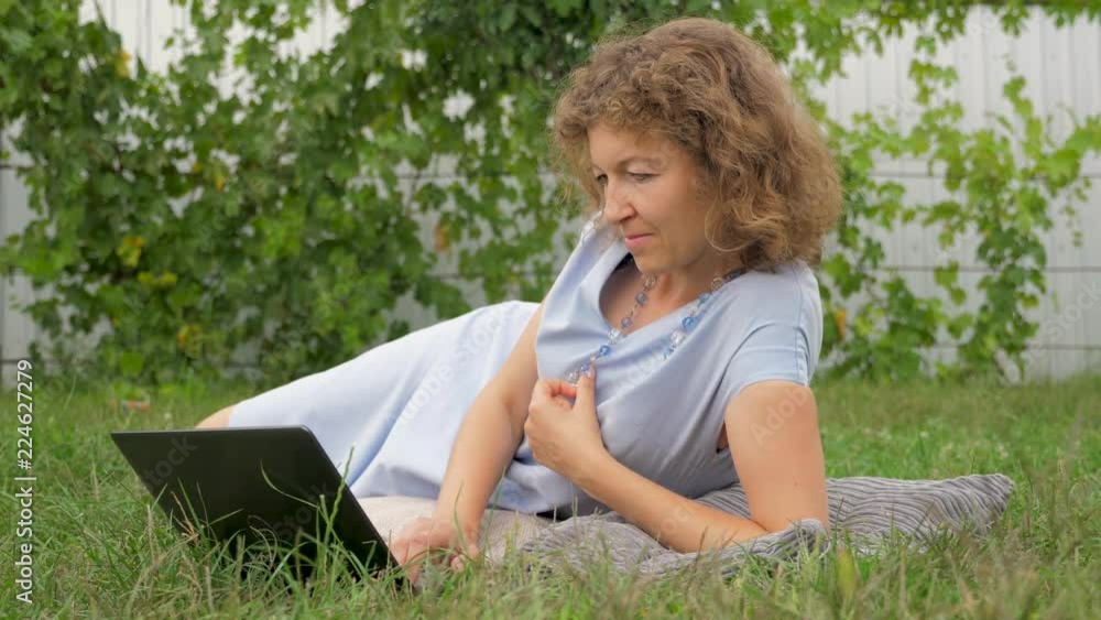 Lady with notebook working outdoor. Working with notebook on fresh air. Business lady working outdoor. Lady with notebook working outdoor. Working with notebook on fresh air. Business lady working outdoor.
