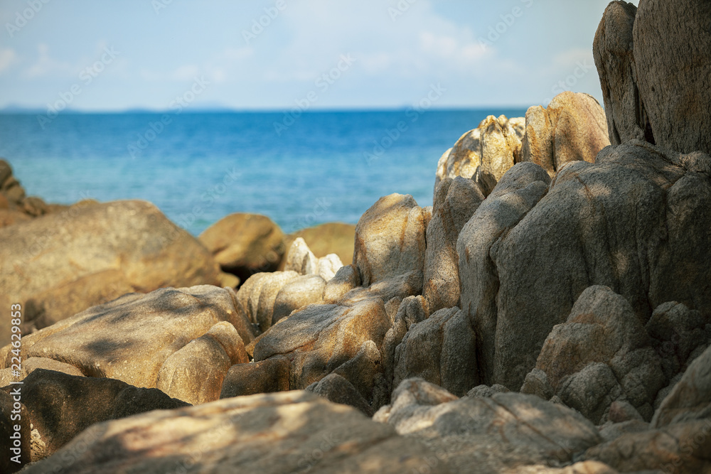 beautiful rock texture and blue sea harbor of tropical island of thailand