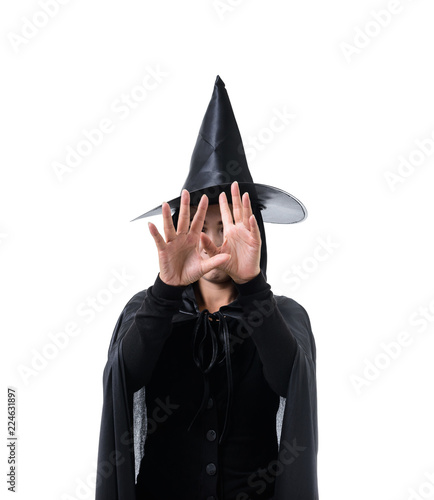 Portrait of woman in black Scary witch halloween costume standing with hat isolated on white background