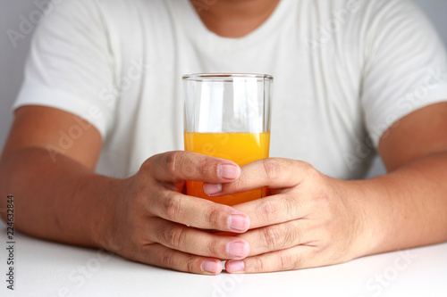 Man hand holds orange juice Healthy drink