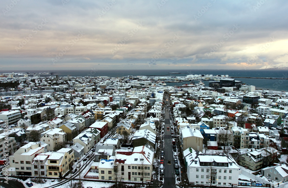   Save Download Preview View of Old Town and seashore from the observation deck of Hallgrimskirkja church in central Reykjavik, Iceland.