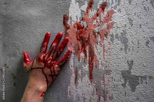 Bloody hand print on wall, crime and horror concept.