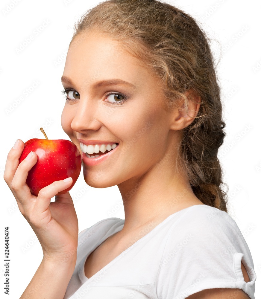 Young woman holding apple isolated on white Young woman holding apple isolated on white