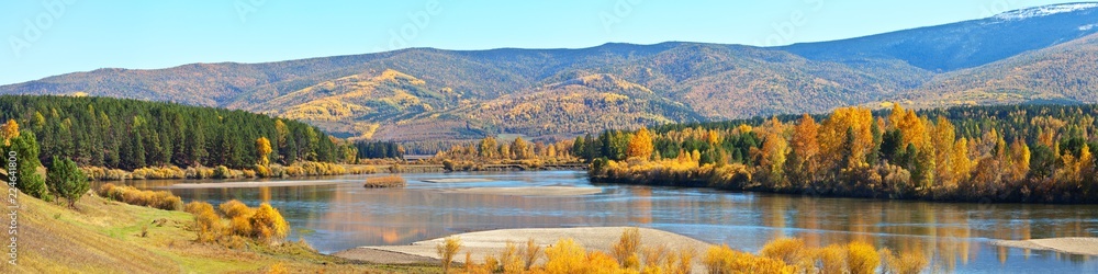 Panoramic view of the Irkut River on a September sunny day. Bright Autumn Landscape