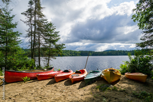 Kayaks and a canoe by the Indian lake in upstate NY (USA) photo