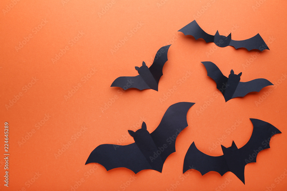 Halloween paper bats on orange background Halloween paper bats on orange background