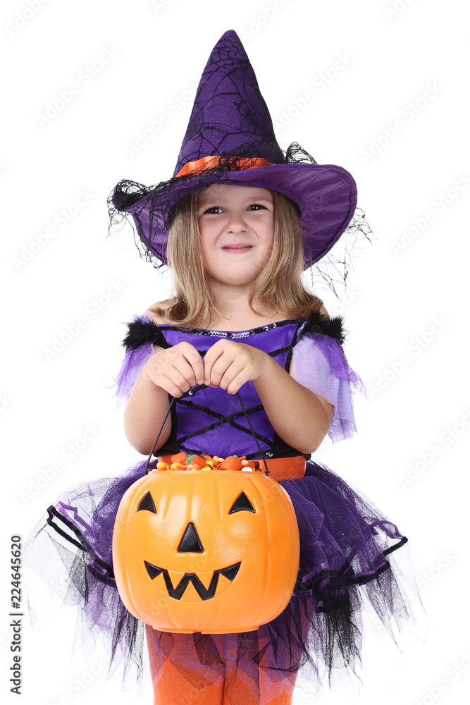 Young girl in halloween costume with pumpkin bucket on white background Young girl in halloween costume with pumpkin bucket on white background