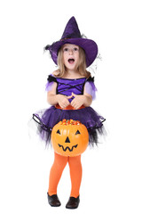Young girl in halloween costume with pumpkin bucket on white background