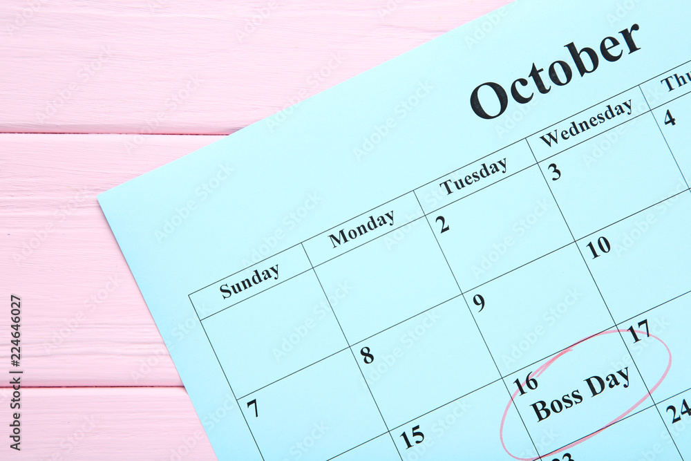 Inscription Boss Day in calendar on wooden table Inscription Boss Day in calendar on wooden table