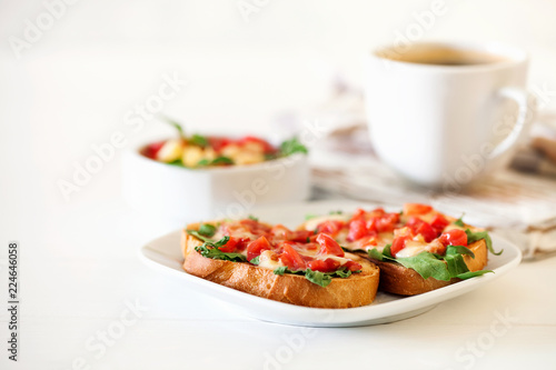  bruschetta with tomatoes, mozzarella cheese and herbs