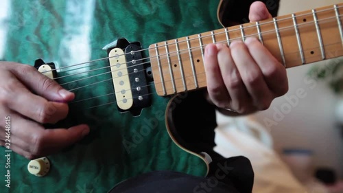 Close up playing electric blue guitar solo