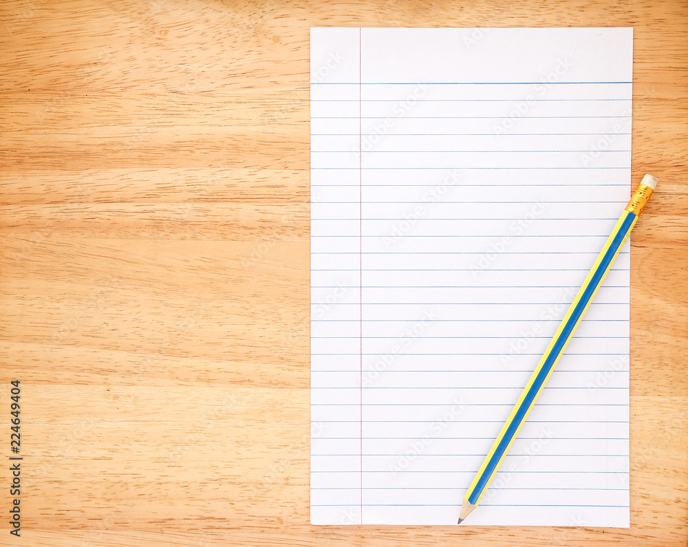 Notebook Lined Paper and pencil on wood Background Notebook Lined Paper and pencil on wood Background