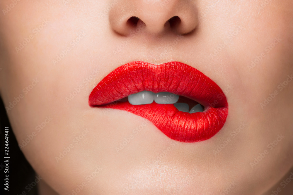 Close-up Beauty Portrait Model Big Sexy Lips, Mouth Open, White Teeth Bit her lower Lip, Seductive Lips Red. Macro image of Perfect Plump Lips. Beautiful Woman Bit her Lip Passionately, white Teeth Close-up Beauty Portrait Model Big Sexy Lips, Mouth Open, White Teeth Bit her lower Lip, Seductive Lips Red. Macro image of Perfect Plump Lips. Beautiful Woman Bit her Lip Passionately, white Teeth
