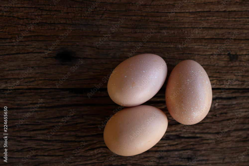 Hen eggs on wood background. Top View. Hen eggs on wood background. Top View.