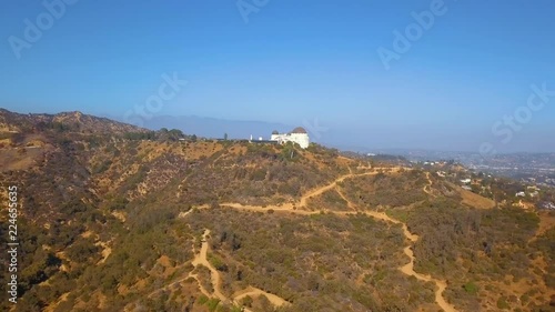 Aerial view on the Hollywood sign district with private houses and road leading to Griffin park.
