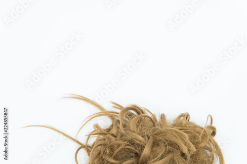 Curly brown and blond hair isolated on white. Copy space.
