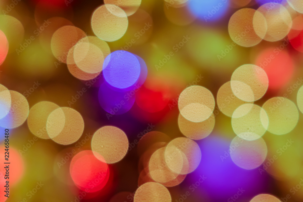 Fototapeta premium abstract blurred lights on background in gold, purple, orange colors. - christmas celebration concept