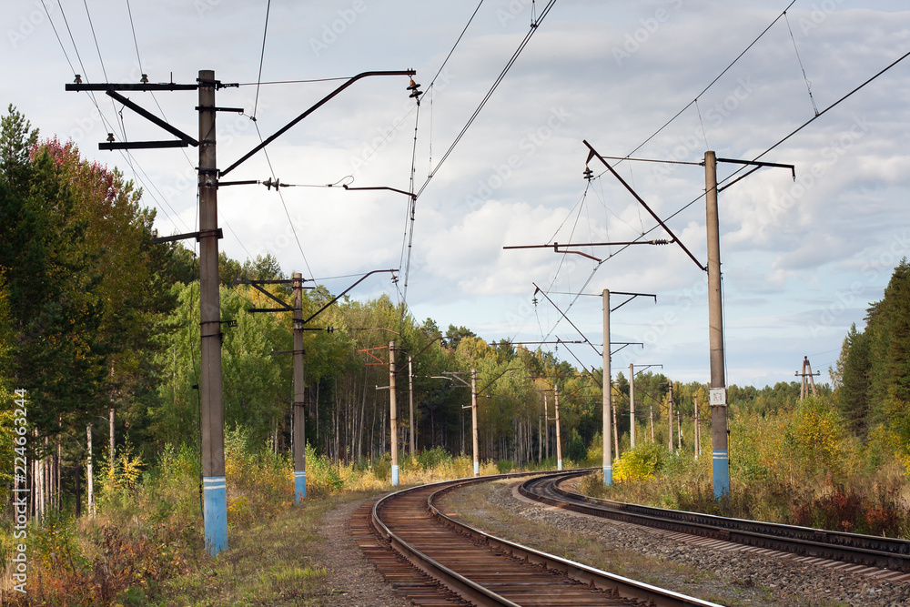 electrified railway in the forest
