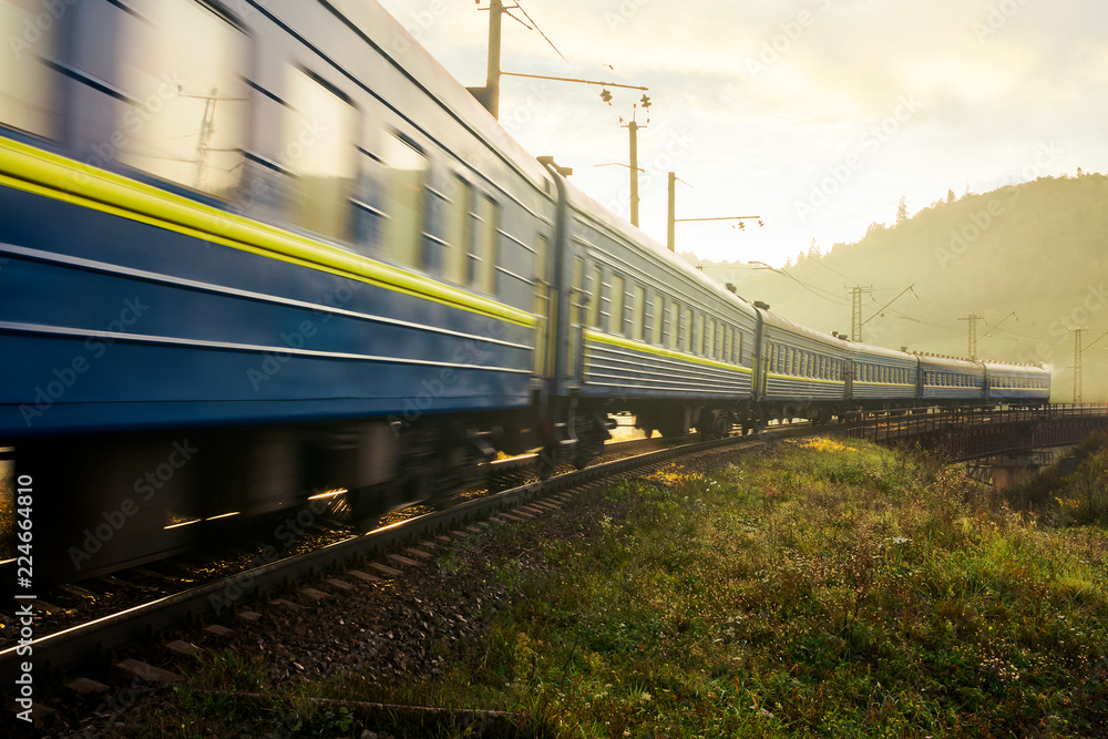 fast moving train through viaduct in mountains. old fashioned transportation concept. lovely countryside at sunrise fast moving train through viaduct in mountains. old fashioned transportation concept. lovely countryside at sunrise