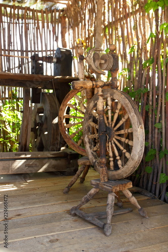 Old distaff. Spinning wheel. Device for making yarns. Vintage distaff in museum of antiquities