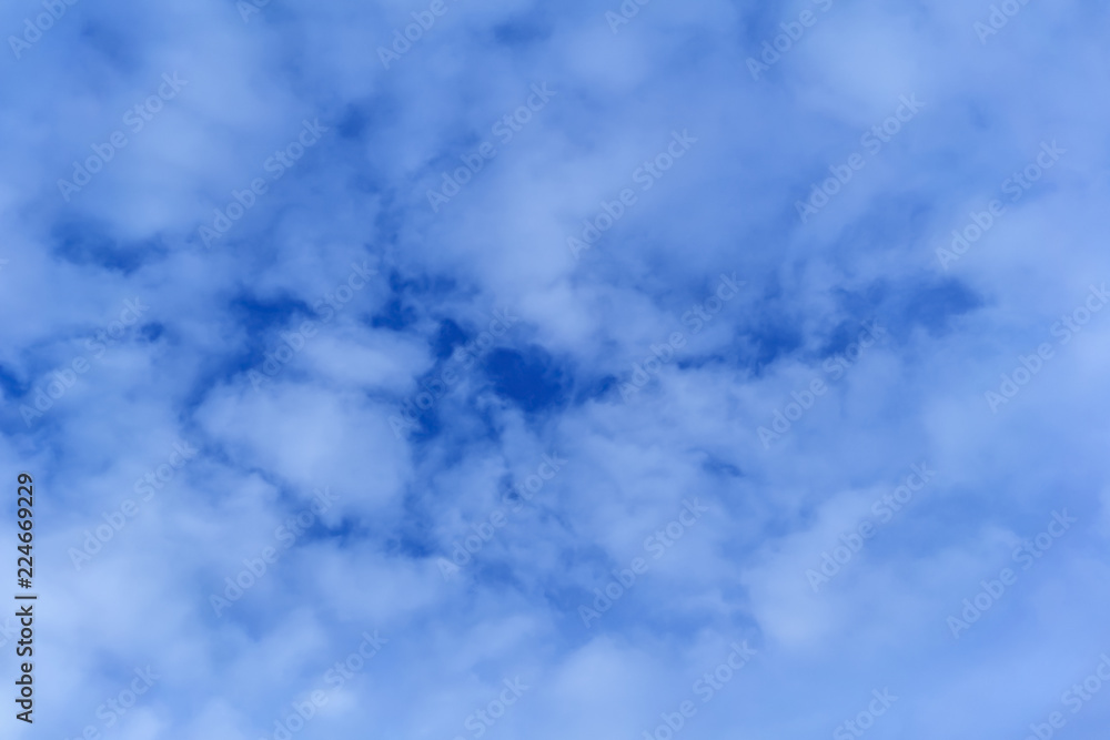 celestial background - blue day sky with white cirro-cumulus clouds celestial background - blue day sky with white cirro-cumulus clouds