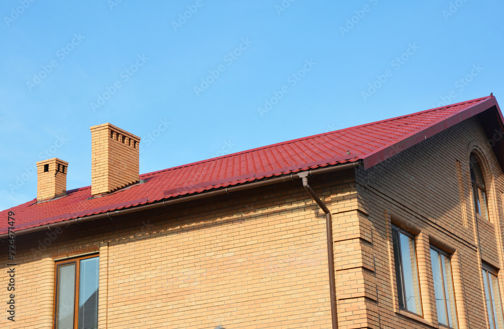 Brick house red metal roofing with olastic rain gutter pipeline system