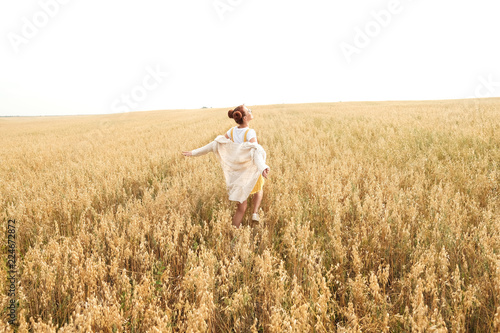 girl with red hair in the autumn field of wheat © Григорий Попов