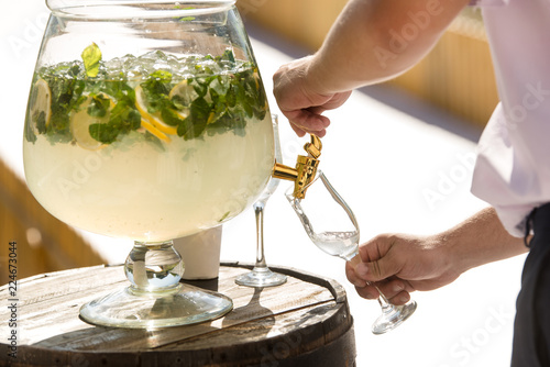 Waiter makes lemonade photo