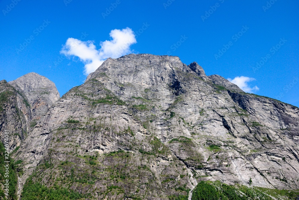 View of nearby mountains and waterfalls from the Geirangerfjord in Norway
