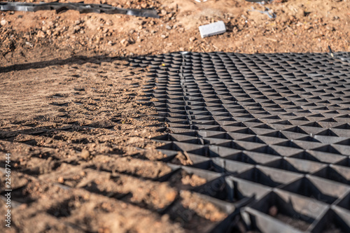 black geogrid filled with a soil for stability of steep hill