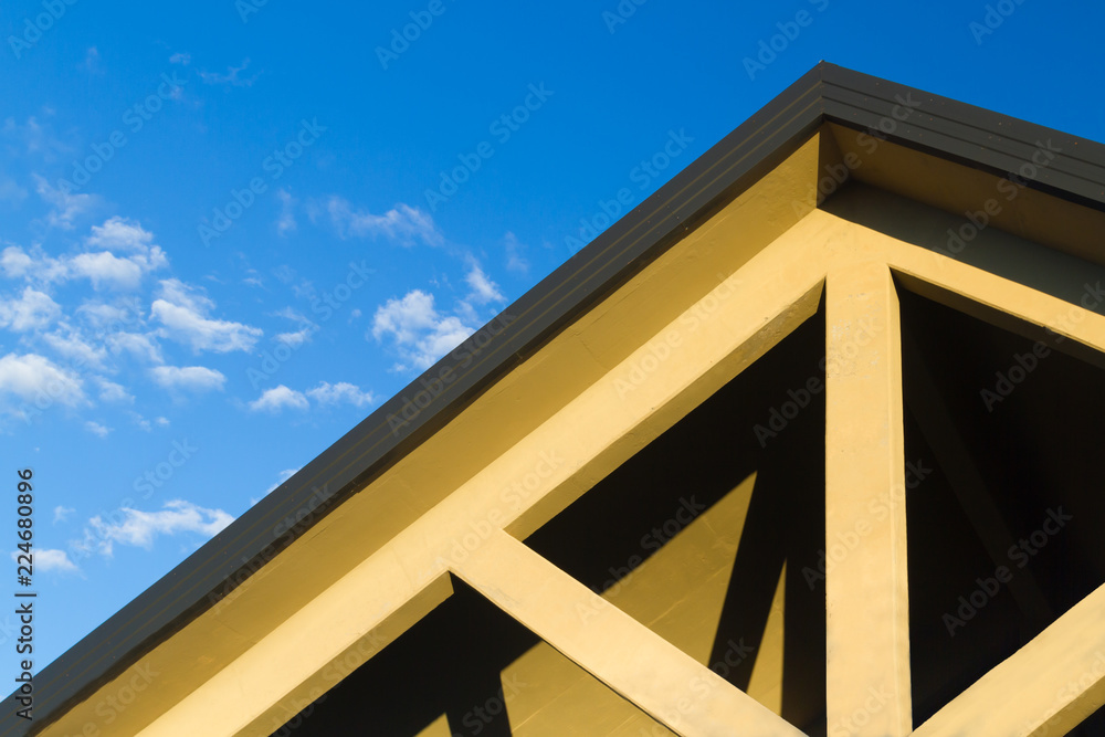 House roof top with blue sky in background House roof top with blue sky in background