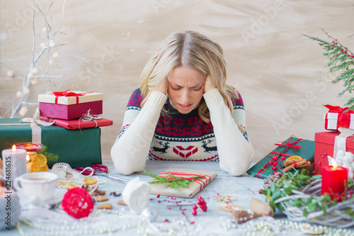 Woman in stress about Christmas holidays photo