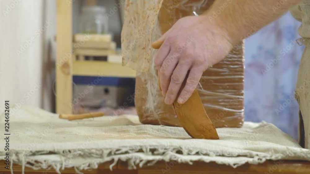 Potter kneads the clay Potter kneads the clay