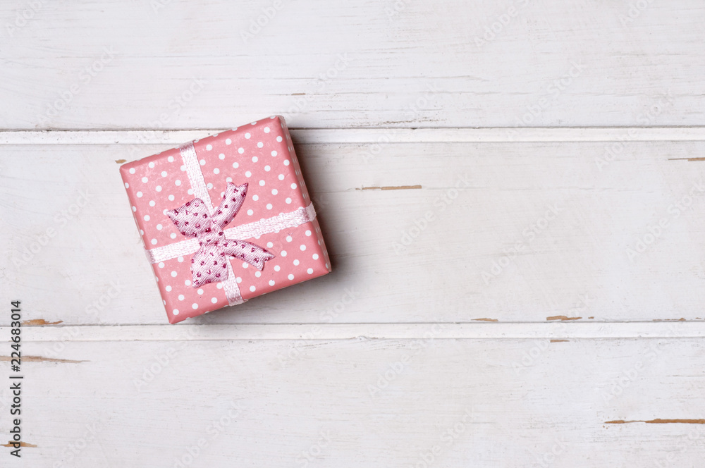 Fototapeta premium Gift box on wooden board. 