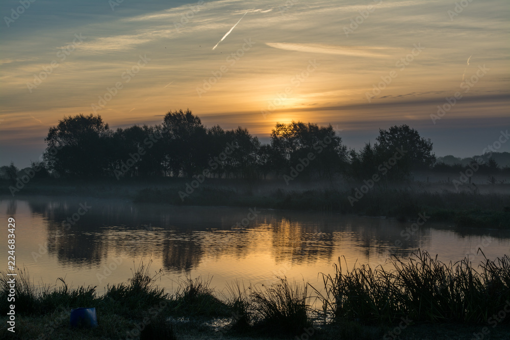 Sunrise Lake with trees reflected