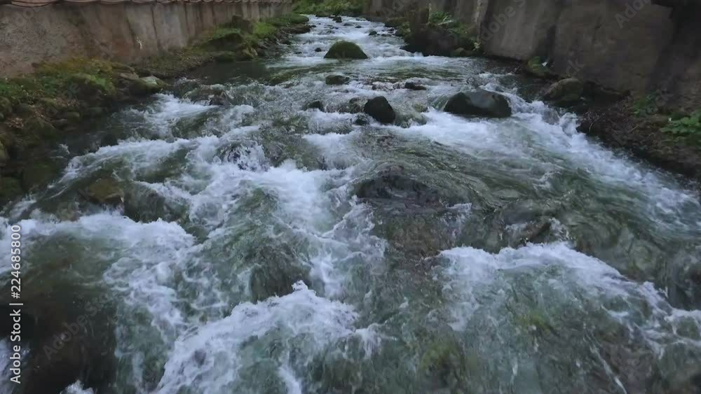 Fast rocky river flowing in Caucasian mountains in Kutaisi, travel to Georgia Fast rocky river flowing in Caucasian mountains in Kutaisi, travel to Georgia
