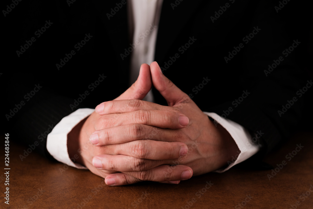CLOSEUP BUSINESS MAN HAND IN SUIT ON TABLE CLOSEUP BUSINESS MAN HAND IN SUIT ON TABLE